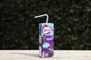 Ribena carton with paper straw instead of plastic on an outdoor wooden surface with green background