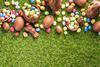 Coloured Easter eggs on grass background