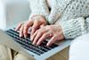elderly woman on laptop computer online