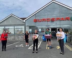 Mulkerns staff with gifts from Killeavy GAA sports team