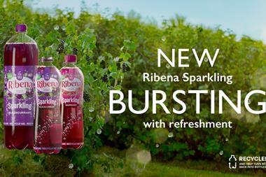 Ribena Sparkling advert showing bottle of drink in front of blackcurrant bushes