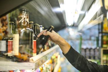 GettyImages_Reaching for a beer on shelf_Credit GoodLifeStudio