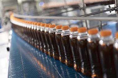 On-the-go soft drinks bottles made from recycled plastic on a production line