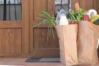 grocery delivery bags on doorstep
