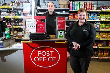 Postmaster Andrew Board with Post Office in a Box inside store