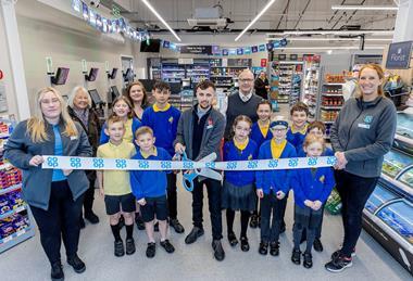 James Thirlway (Manager) jand pupils from Harlands Community Primary School who helped to cut the ribbon and launch the store to serve the community