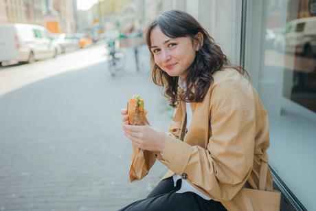 GettyImages_Eating sandwich outside_Credit Oleh_Slobodeniuk