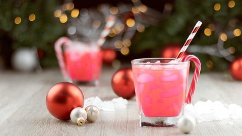 GettyImages_Pink cocktails with candy cane and baubles_Credit dropStock