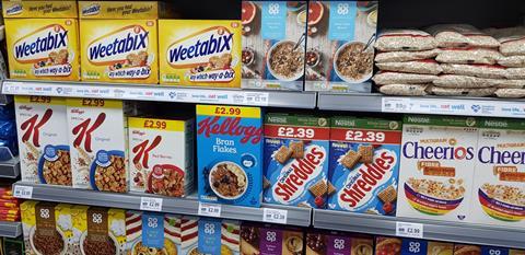 Healthy cereals on shop shelf including Weetabix, Shreddies, Bran Flakes.