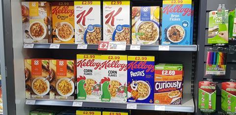 Breakfast cereals on shop shelf including Corn Flakes, Special K, Crunchy Nut and Frosties.