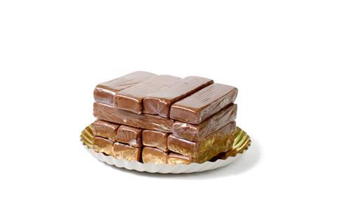 Piles of individually wrapped chocolate cake slices