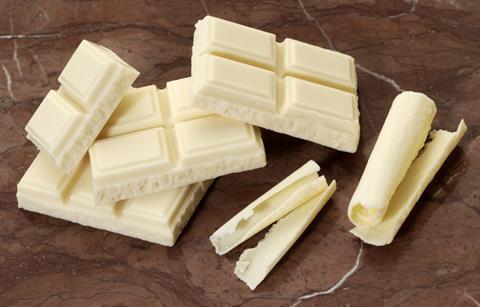 Squares and shavings of white chocolate