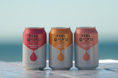 Feel Good Drinks 3 cans in front of sea