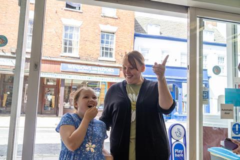 Olivia and mum Kerry seeing her artwork for the first time