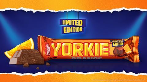 An orange Yorkie chocolate bar on a blue background