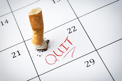 Stubbing out a cigarette on a calendar