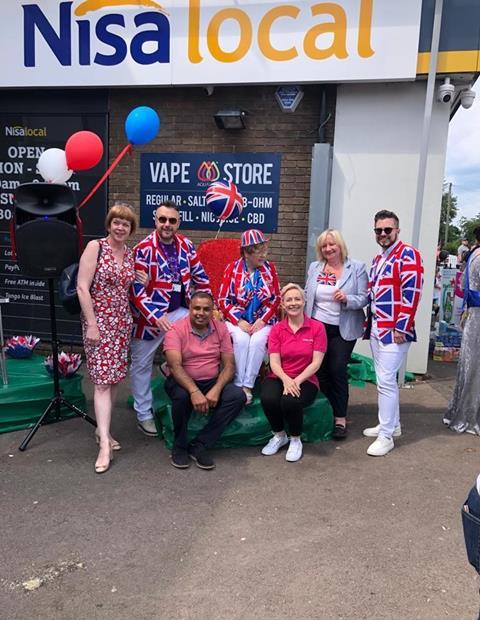 Store owner H (centre left) with local MP (far left), Lord Mayor (centre) and Kate Carroll, Head of Nisa's MADL charity (centre right)