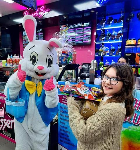 Easter Bunny with child in-store