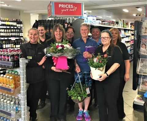 Customer service assistant Theresa Wesley celebrates with Co-op colleagues
