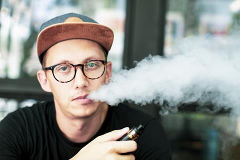 Vaping outside a cafe