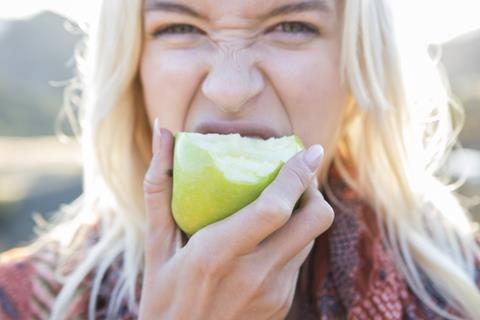GettyImages_Woman eating apple_Credit Sam Diephuis