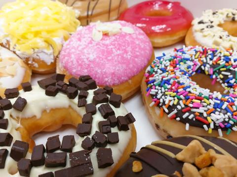 A selection of colourful iced, filled and topped donuts