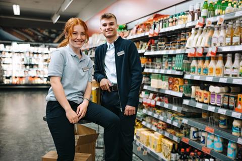 Two young store employees