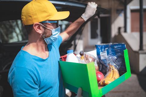 Man outside delivery groceries