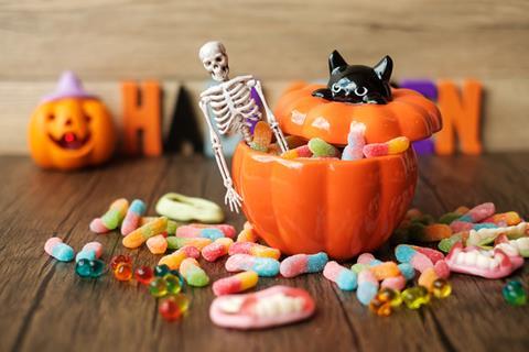 Halloween sweets with ceramic pumpkins