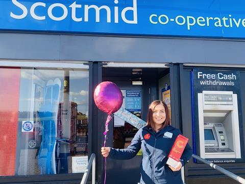 Natalie McKerracher_outside Scotmid with Sales Colleague award