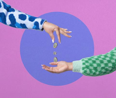 Hand dropping coins into another hand on pink and purple background
