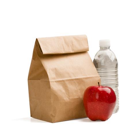 Packed lunch in a brown paper back alongside an apple and a bottle of water