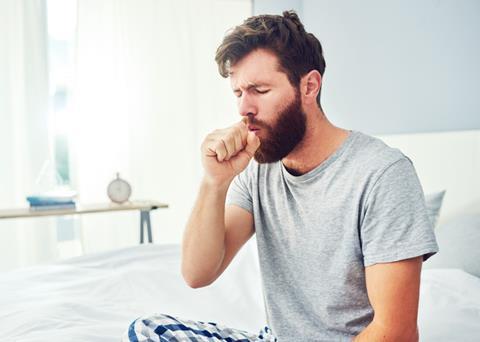 GettyImages_Man in grey t-shirt coughing_Credit Moyo Studio