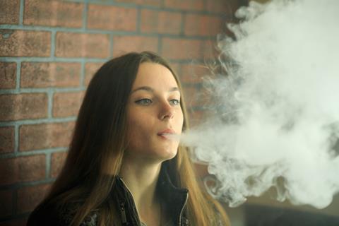 Young female vaping