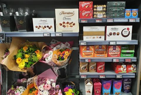 Premium chocolates alongside flowers in store