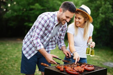 Happy couple having a BBQ