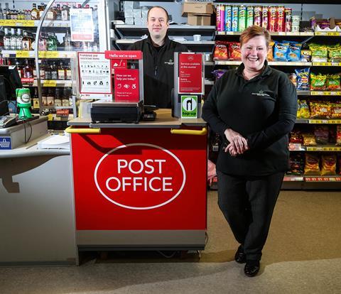 Postmaster Andrew Board with Post Office in a Box inside store